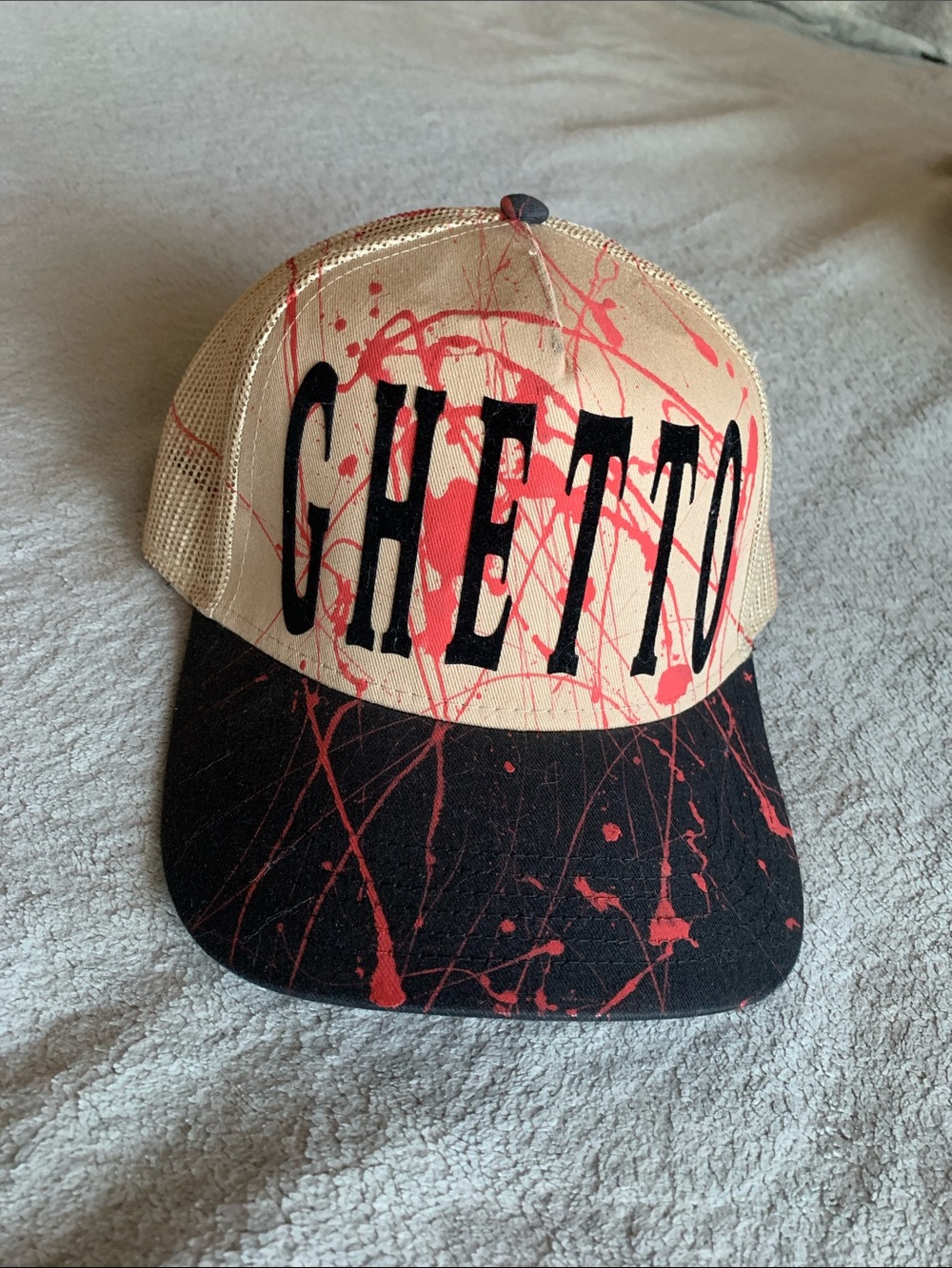 OTTO Beige and Black Mesh Trucker Hat with Red Paint Splatter